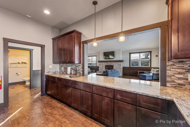39W599 Walt Whitman Road St. Charles, IL 60175 - Photo 53 of 74 a large kitchen with kitchen island granite countertop a sink and cabinets