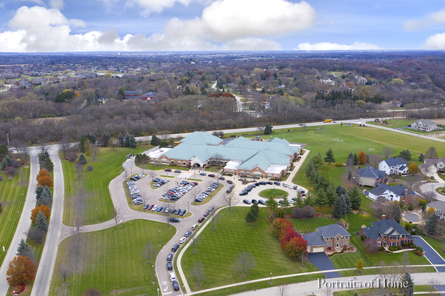 39W599 Walt Whitman Road St. Charles, IL 60175 - Photo 55 of 74 an aerial view of a swimming pool a yard and mountain view
