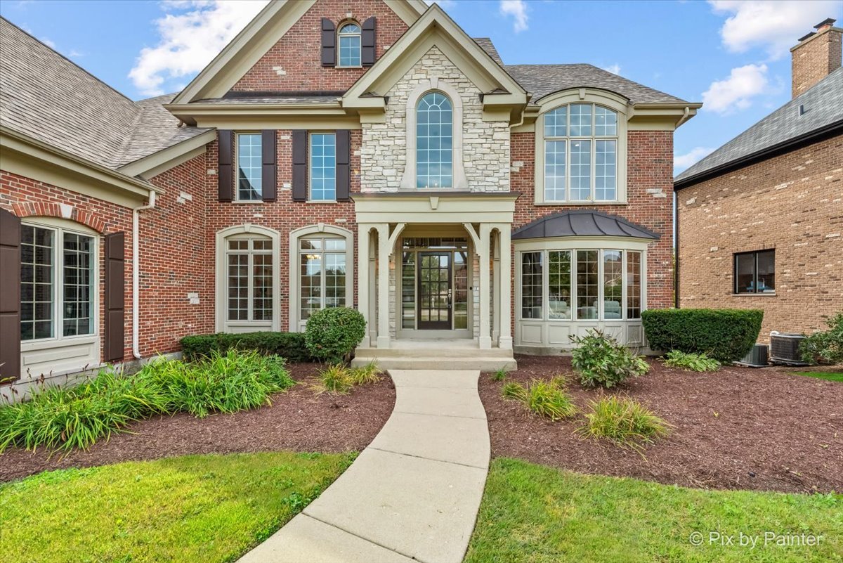 39W599 Walt Whitman Road St. Charles, IL 60175 - Photo 63 of 74 a front view of a house with garden