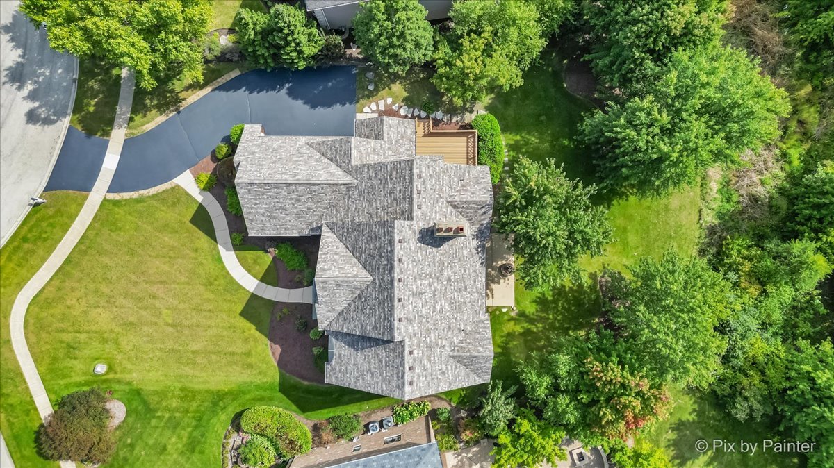 39W599 Walt Whitman Road St. Charles, IL 60175 - Photo 65 of 74 an aerial view of a house with swimming pool and large trees