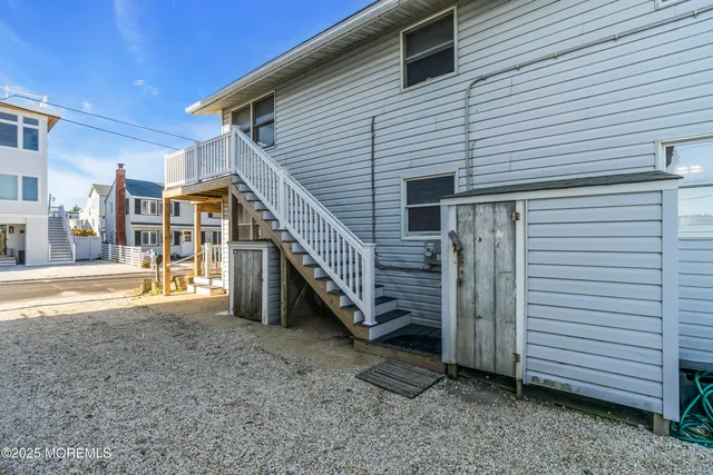 a view of a kitchen with furniture and a ceiling fan
