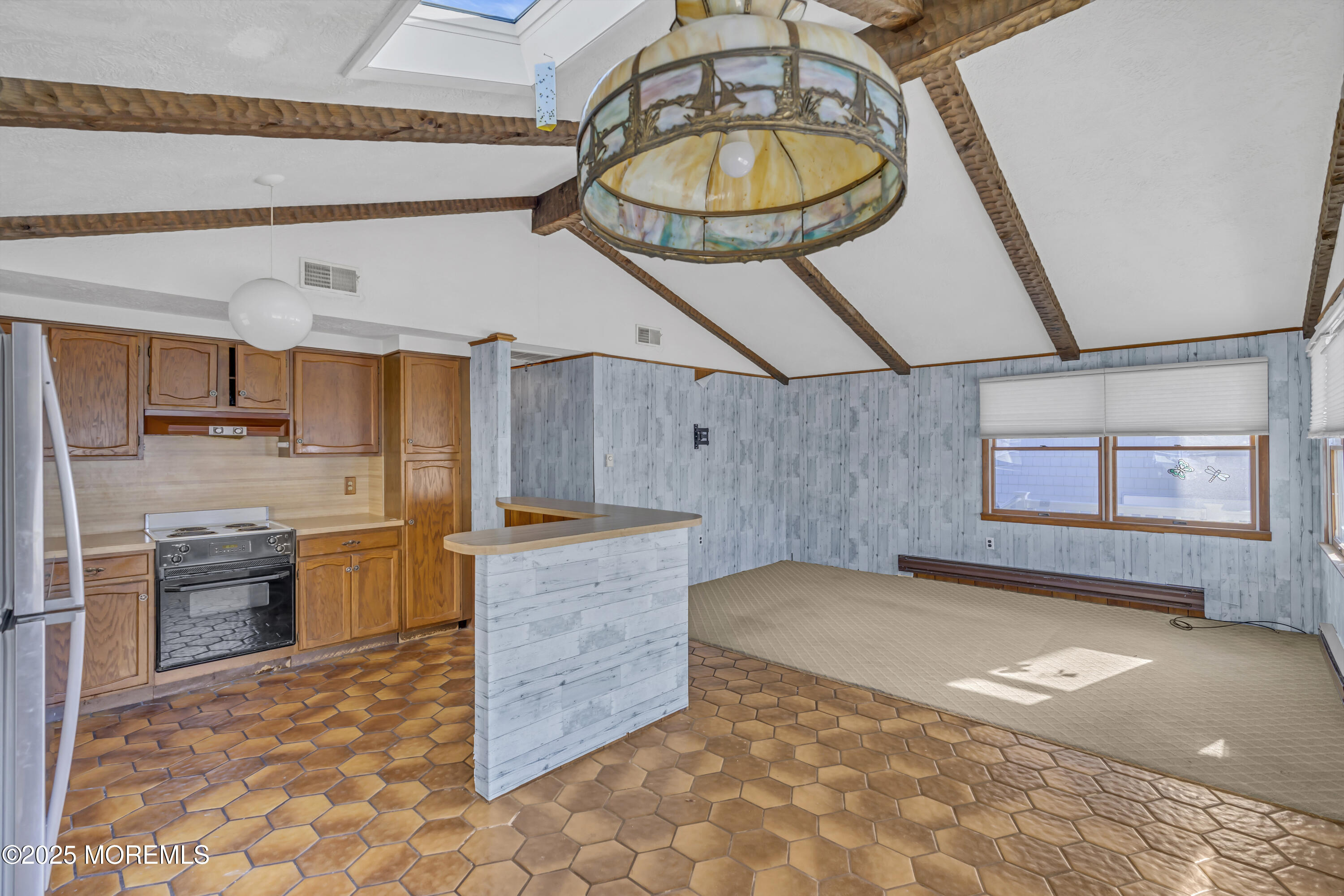 113 East Mermaid Lane Beach Haven, NJ 08008 - Photo 24 of 34 a view of a kitchen with a sink and a refrigerator