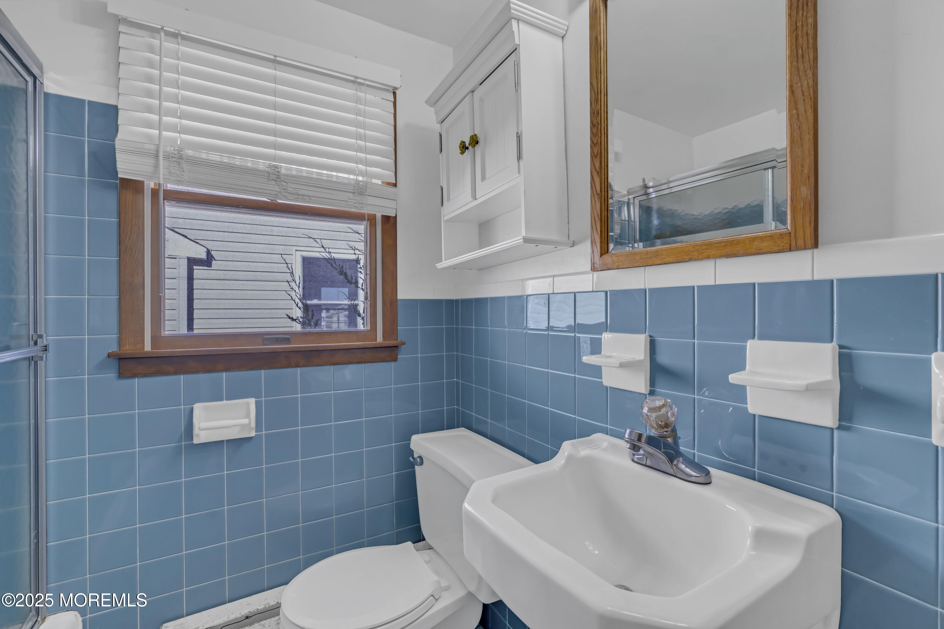 113 East Mermaid Lane Beach Haven, NJ 08008 - Photo 30 of 34 a bathroom with a toilet sink and mirror