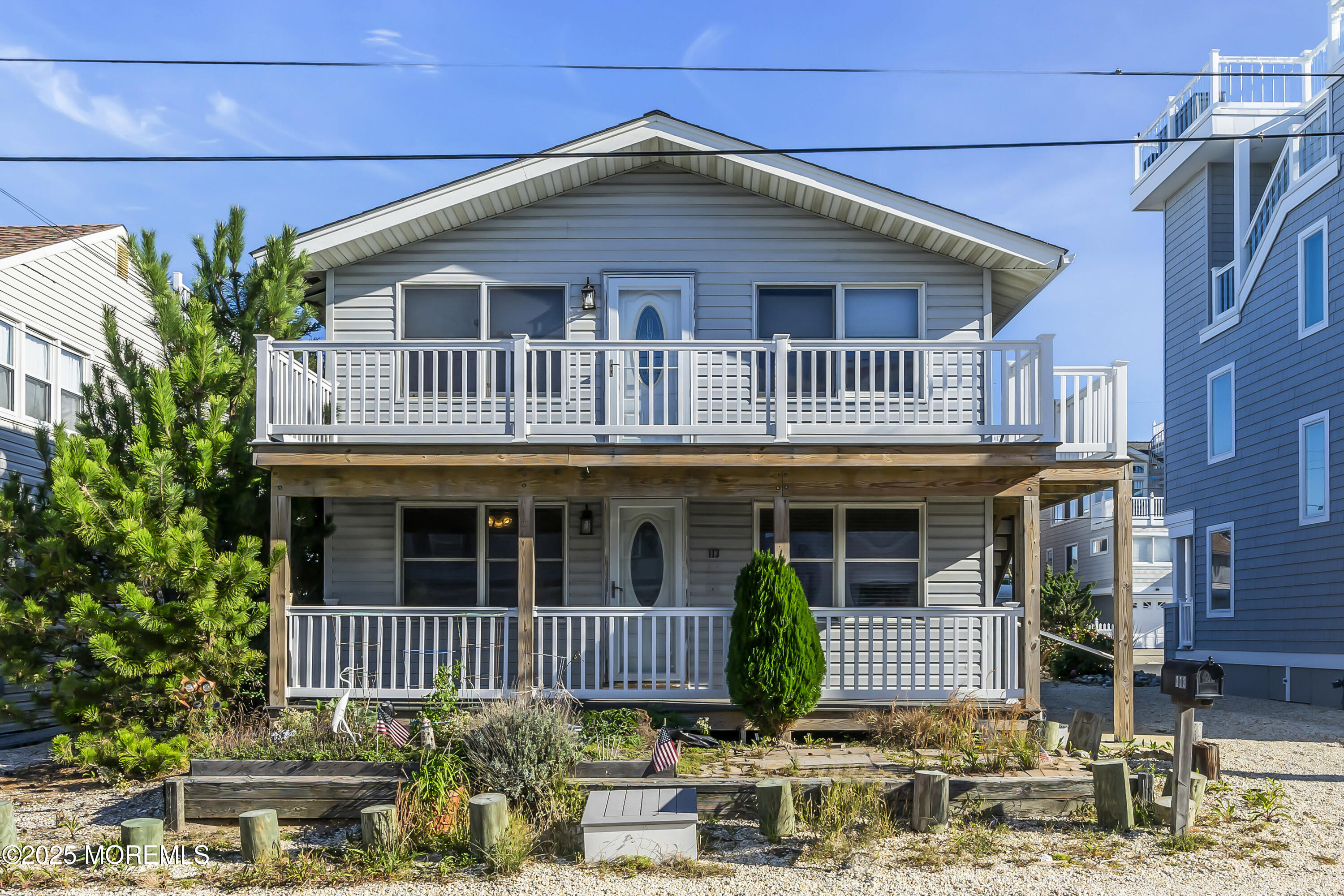 113 East Mermaid Lane Beach Haven, NJ 08008 - Photo 3 of 34 a front view of a house with a porch