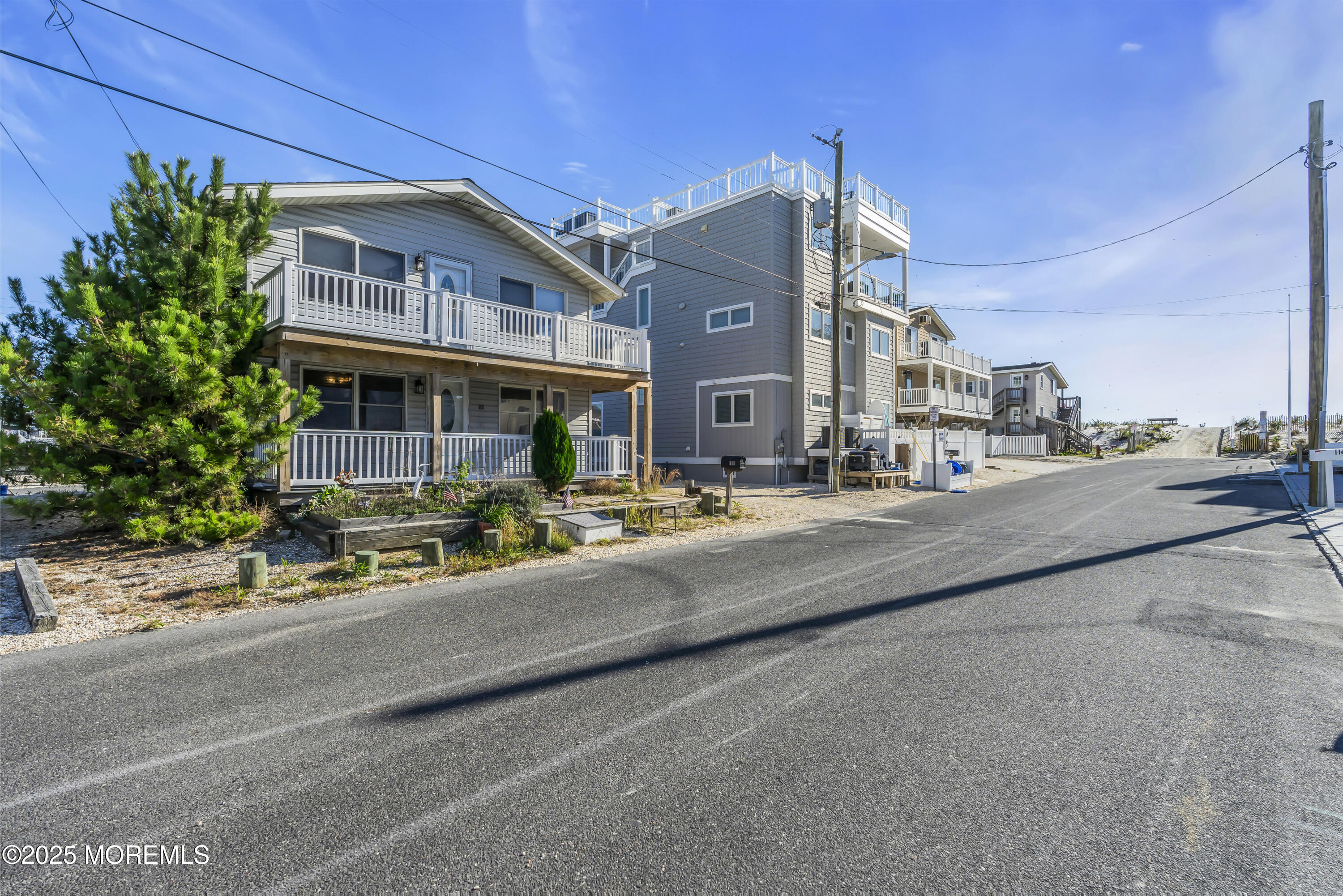 113 East Mermaid Lane Beach Haven, NJ 08008 - Photo 7 of 34 a view of a street with a building in the background