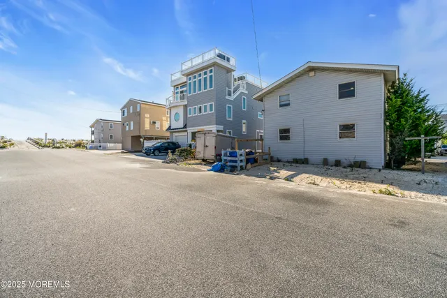 an aerial view of houses with outdoor space