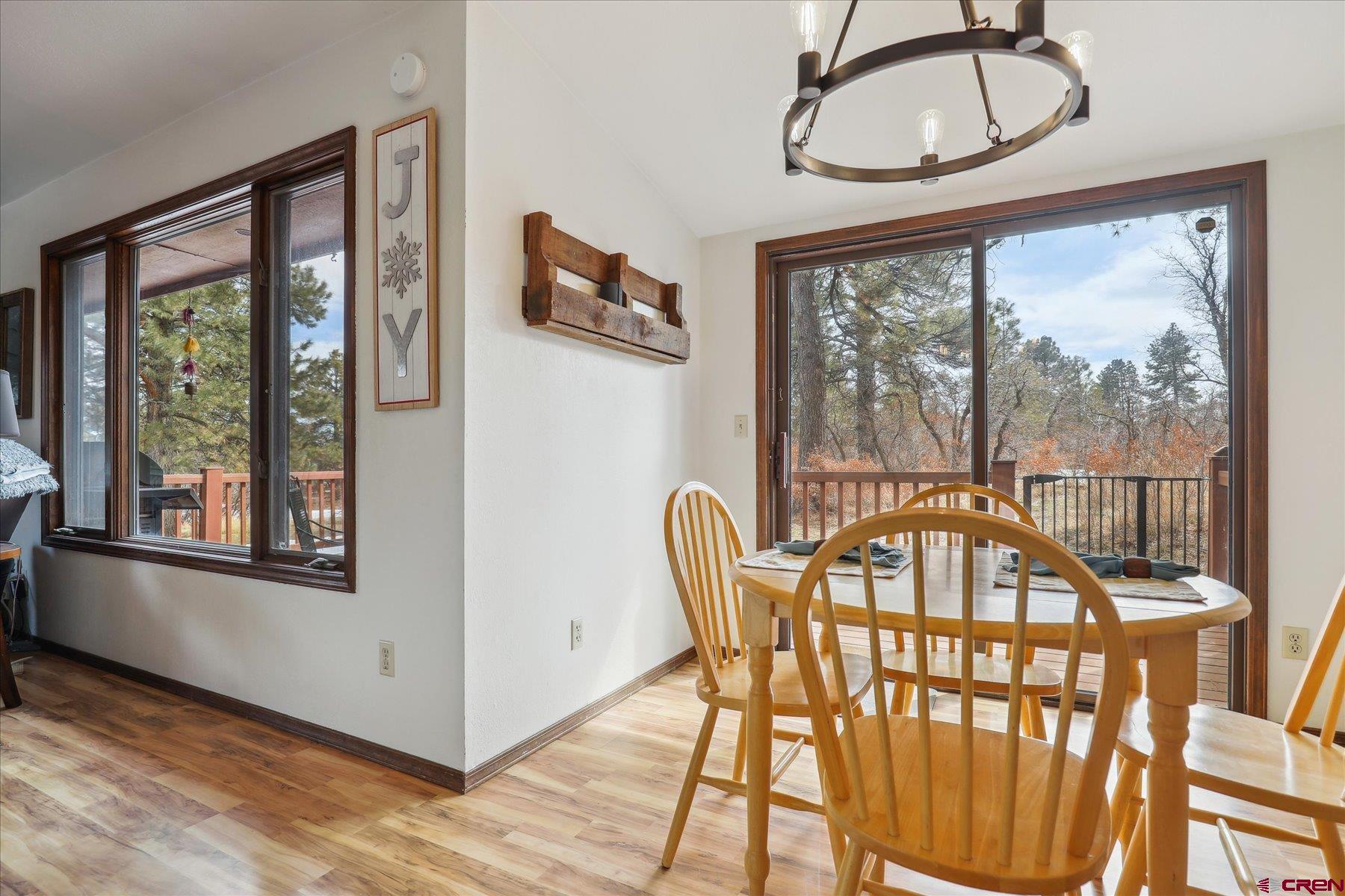 202 Pine Ridge Loop Durango, CO 81301 - Photo 12 of 33 a view of a dining room with furniture window and outside view