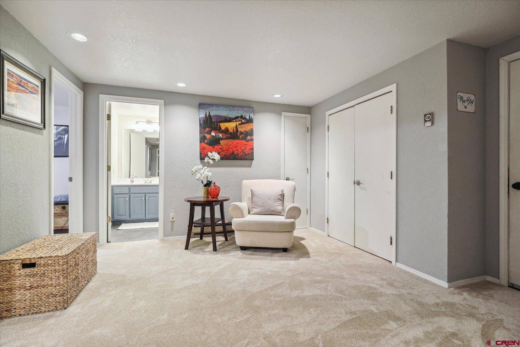 202 Pine Ridge Loop Durango, CO 81301 - Photo 22 of 33 a living room with furniture and a flat screen tv