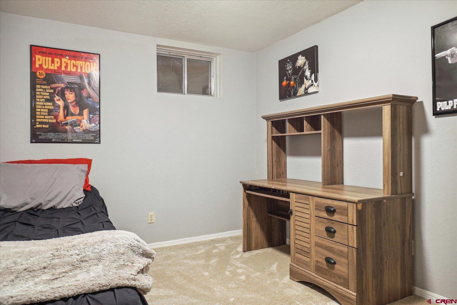 202 Pine Ridge Loop Durango, CO 81301 - Photo 25 of 33 a bedroom with a bed and furniture