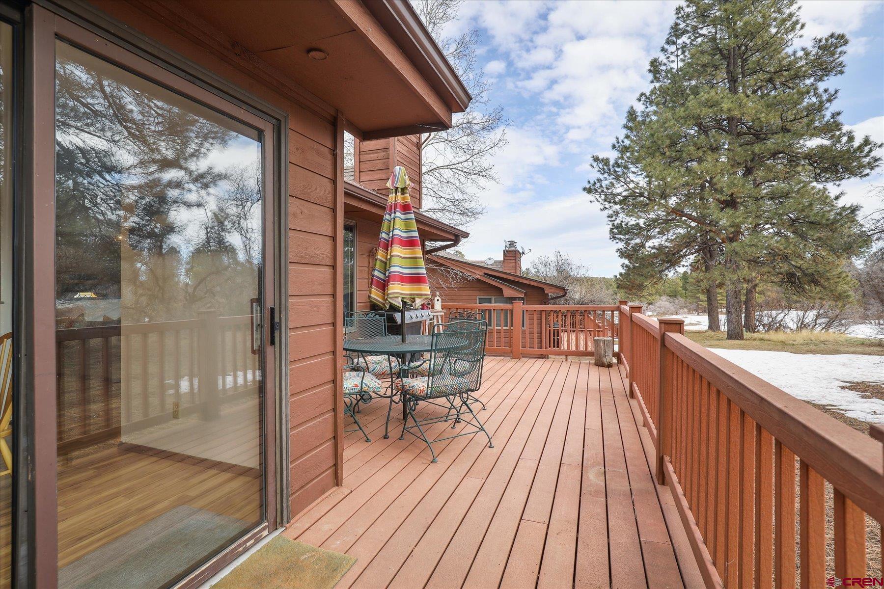 202 Pine Ridge Loop Durango, CO 81301 - Photo 31 of 33 a balcony with wooden floor and outdoor seating