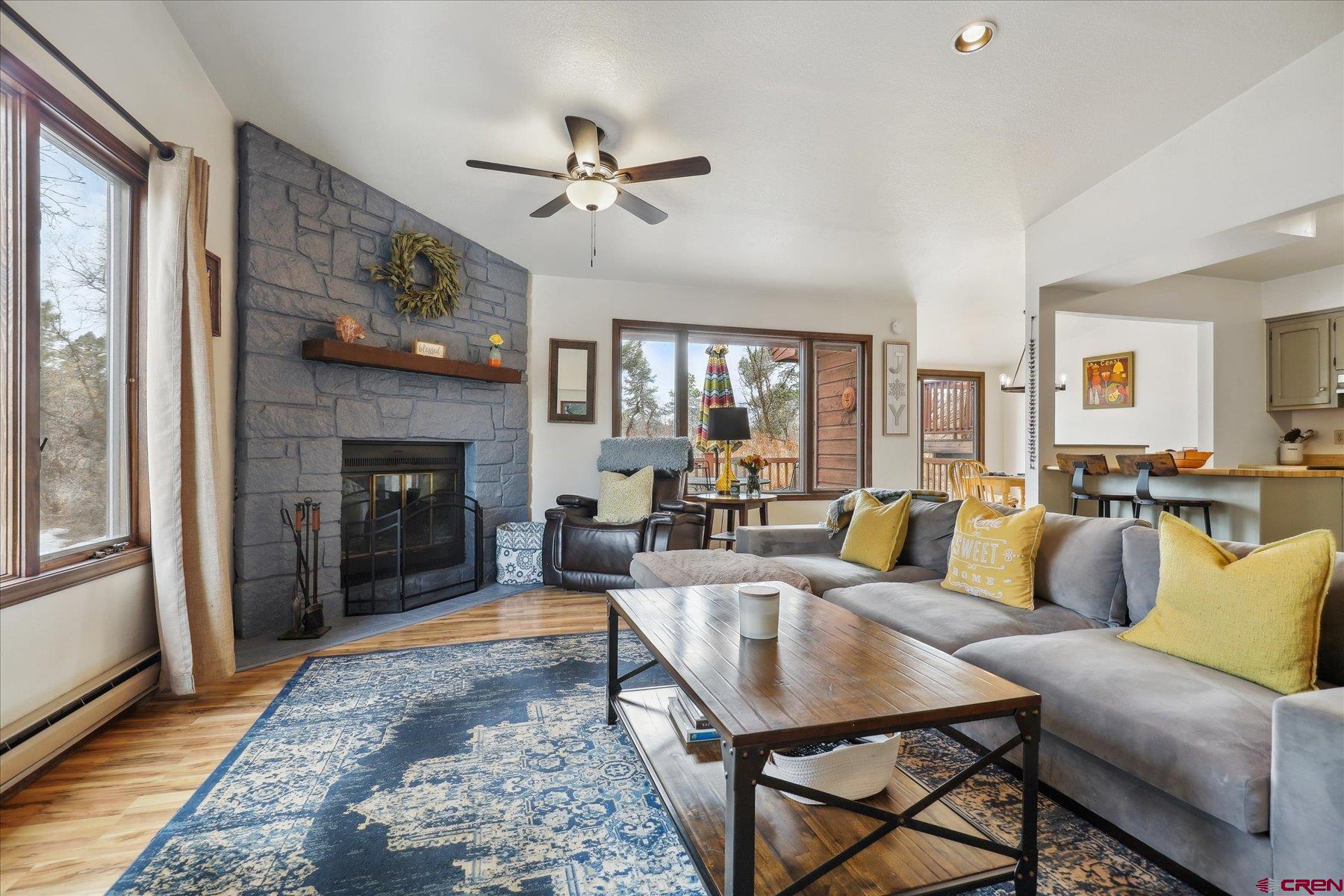 202 Pine Ridge Loop Durango, CO 81301 - Photo 4 of 33 a living room with furniture and a fireplace