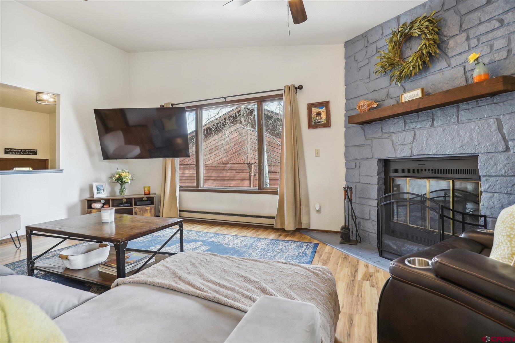 202 Pine Ridge Loop Durango, CO 81301 - Photo 7 of 33 a living room with furniture and a flat screen tv