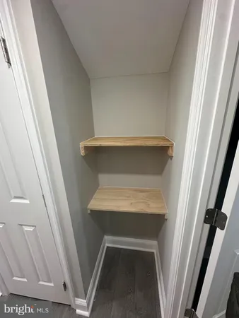 a view of balcony with wooden floor and fence