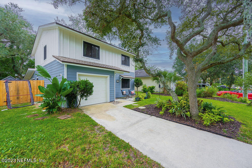 1210 16th Street North Jacksonville Beach, FL 32250 - Photo 1 of 38 a front view of a house with a yard and potted plants