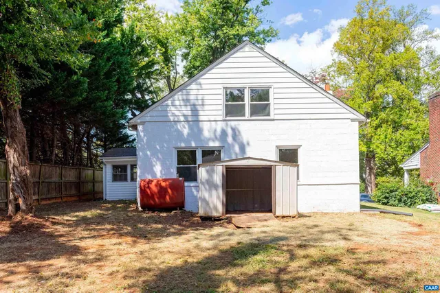 a backyard of a house with a garage