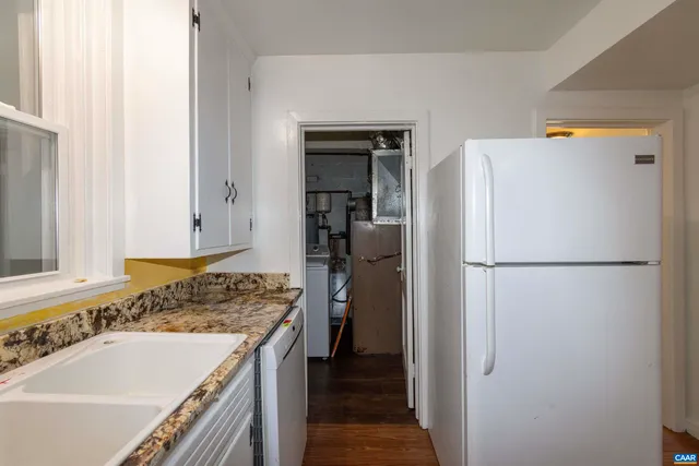 a bathroom with a sink a window and a mirror