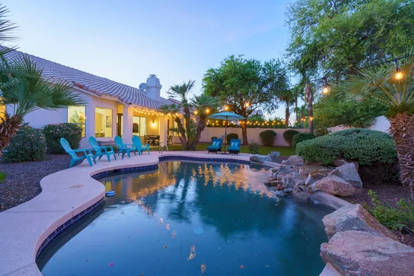a view of swimming pool with outdoor seating