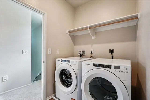 a view of washer and dryer in a utility room