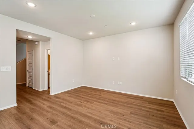 a view of hallway with wooden floor