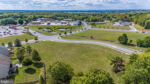 an aerial view of residential house with outdoor space and pool
