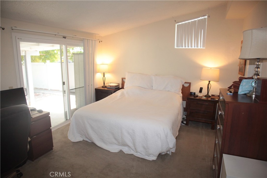 27502 Amethyst Way Castaic, CA 91384 - Photo 11 of 23 a bedroom with a bed and a lamp