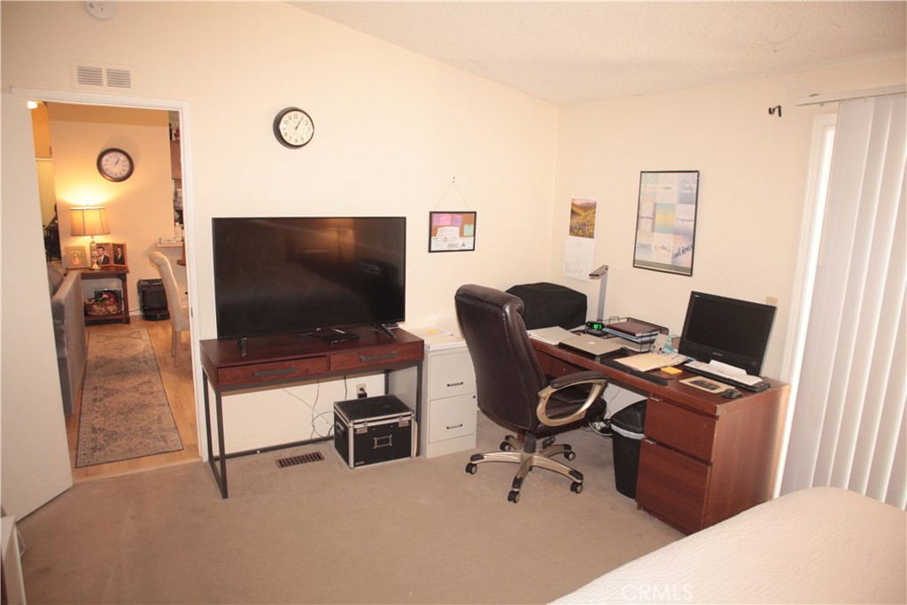 27502 Amethyst Way Castaic, CA 91384 - Photo 12 of 23 a view of a livingroom with workspace and a window
