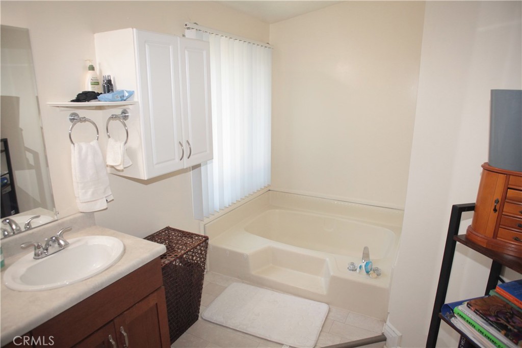 27502 Amethyst Way Castaic, CA 91384 - Photo 13 of 23 a bathroom with a sink and a mirror