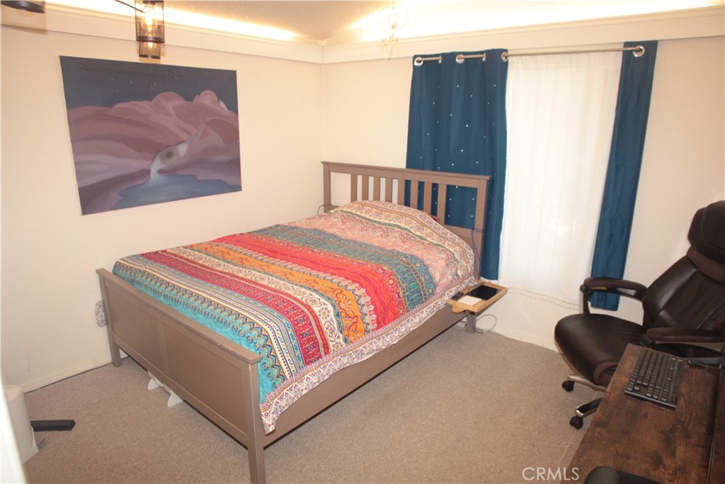 27502 Amethyst Way Castaic, CA 91384 - Photo 16 of 23 a bedroom with a bed and dresser