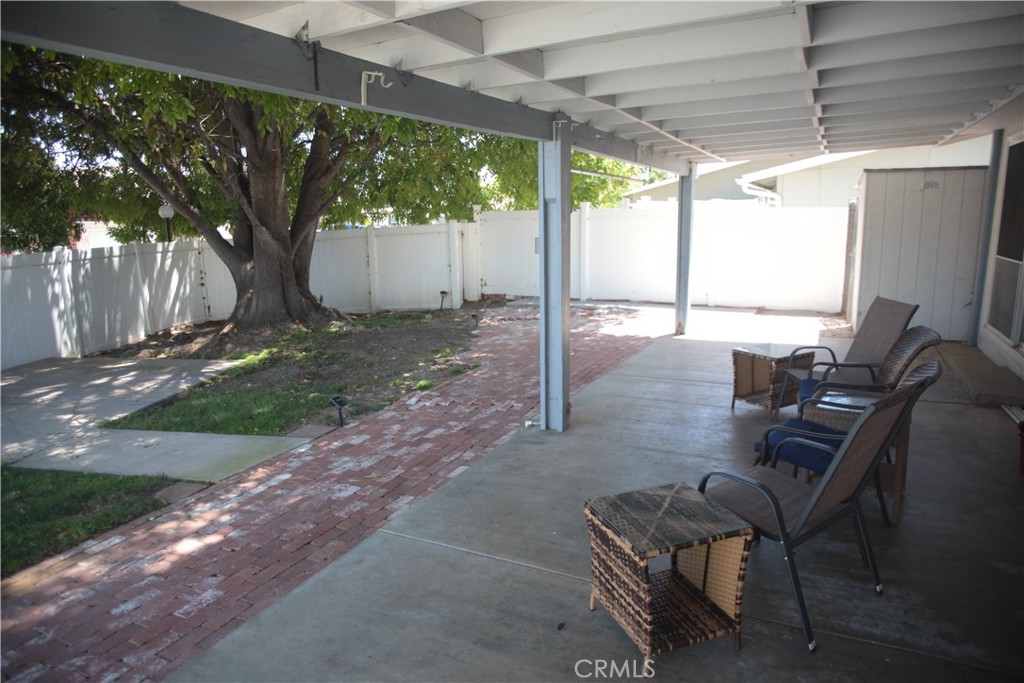 27502 Amethyst Way Castaic, CA 91384 - Photo 22 of 23 a view of a patio with a table chairs and a backyard
