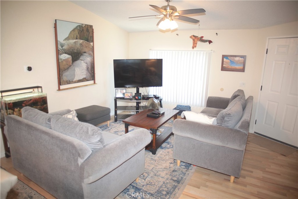 27502 Amethyst Way Castaic, CA 91384 - Photo 3 of 23 a living room with furniture and a flat screen tv