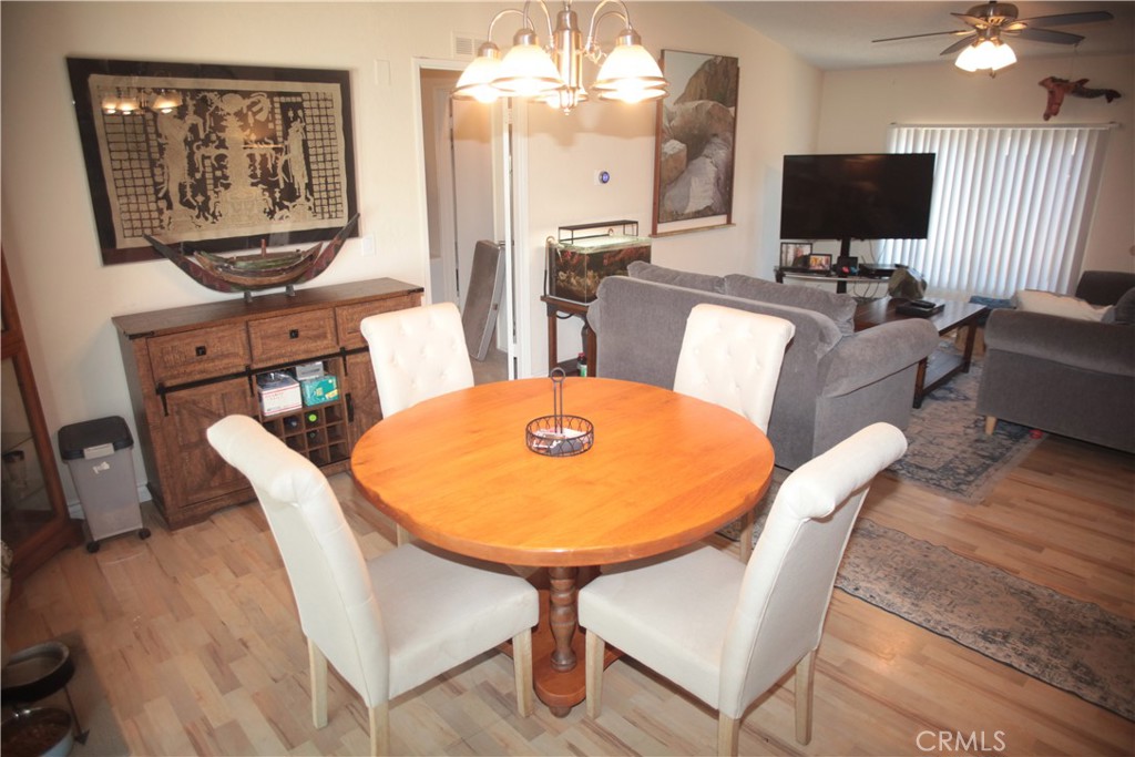 27502 Amethyst Way Castaic, CA 91384 - Photo 5 of 23 a view of a dining room with furniture and wooden floor