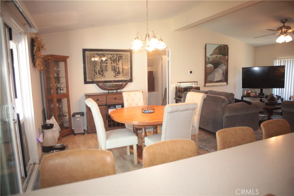 27502 Amethyst Way Castaic, CA 91384 - Photo 6 of 23 a view of a dining room with furniture and a large window