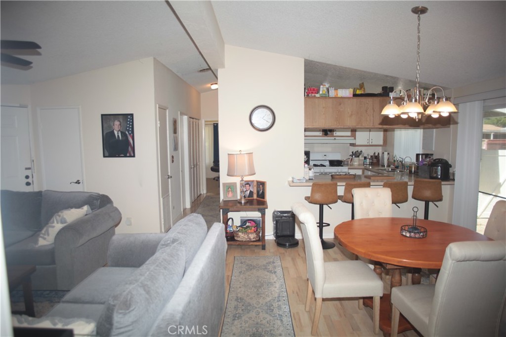 27502 Amethyst Way Castaic, CA 91384 - Photo 10 of 23 a living room with furniture and a chandelier
