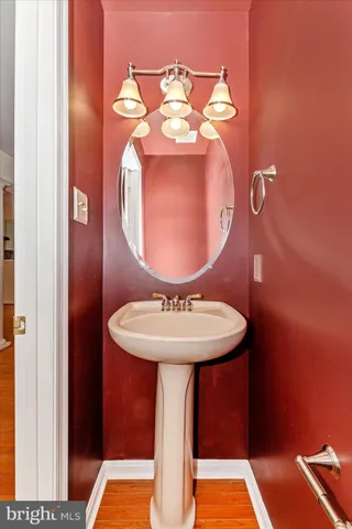 a bathroom with a sink and mirror
