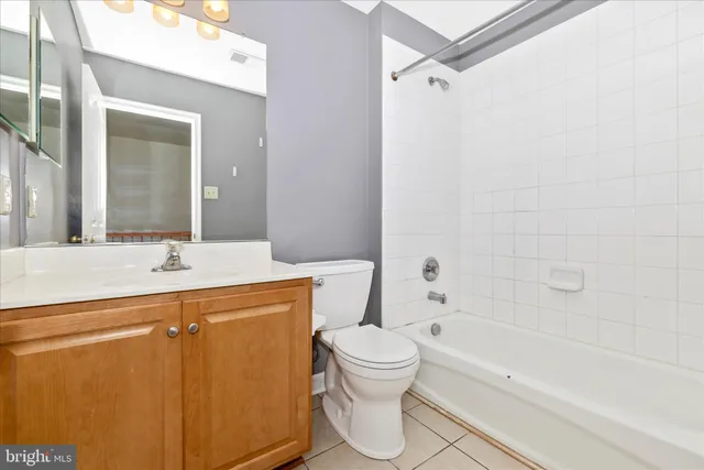 a bathroom with a sink a toilet and a bathtub