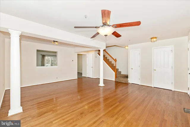 a view of an entryway with wooden floor