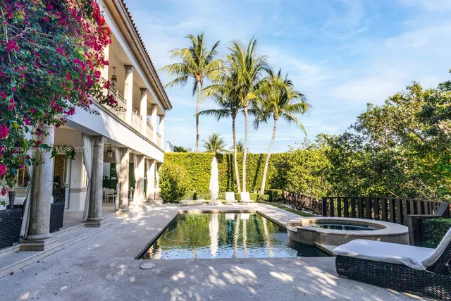 a view of swimming pool with a table and chairs