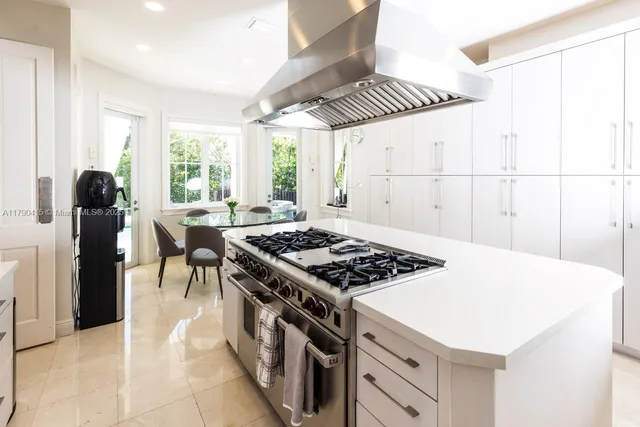 a kitchen with a stove and a refrigerator