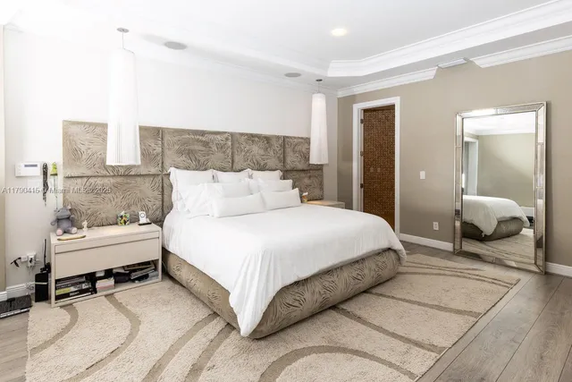 a bedroom with a bed and a couch