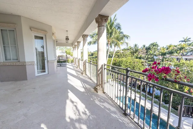 a view of a porch and flowers