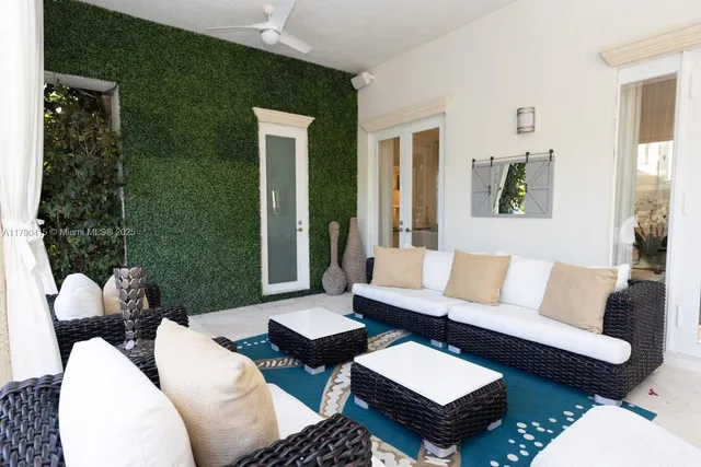 a living room with furniture and a rug