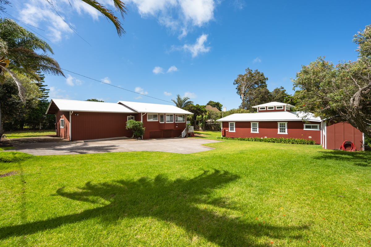 66-1685 Kohala Mountain Road Kamuela, HI 96743 - Photo 24 of 26 a front view of a house with a yard table and chairs