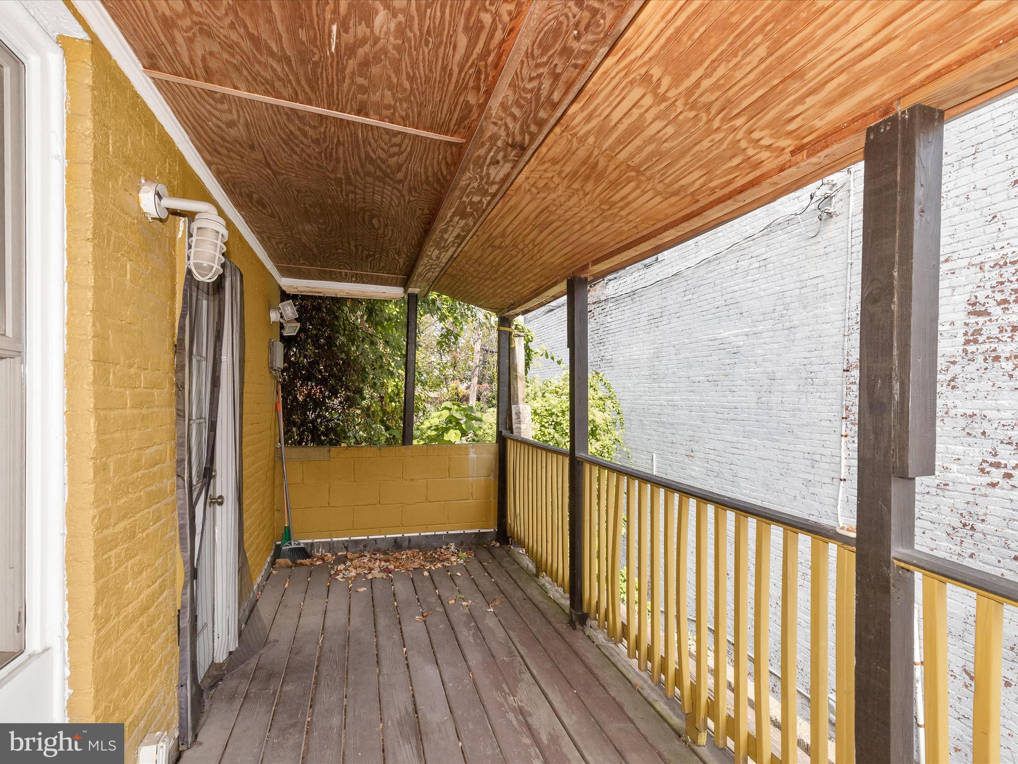 55 South Fulton Avenue Baltimore, MD 21223 - Photo 11 of 55 a view of a porch with wooden floor and furniture