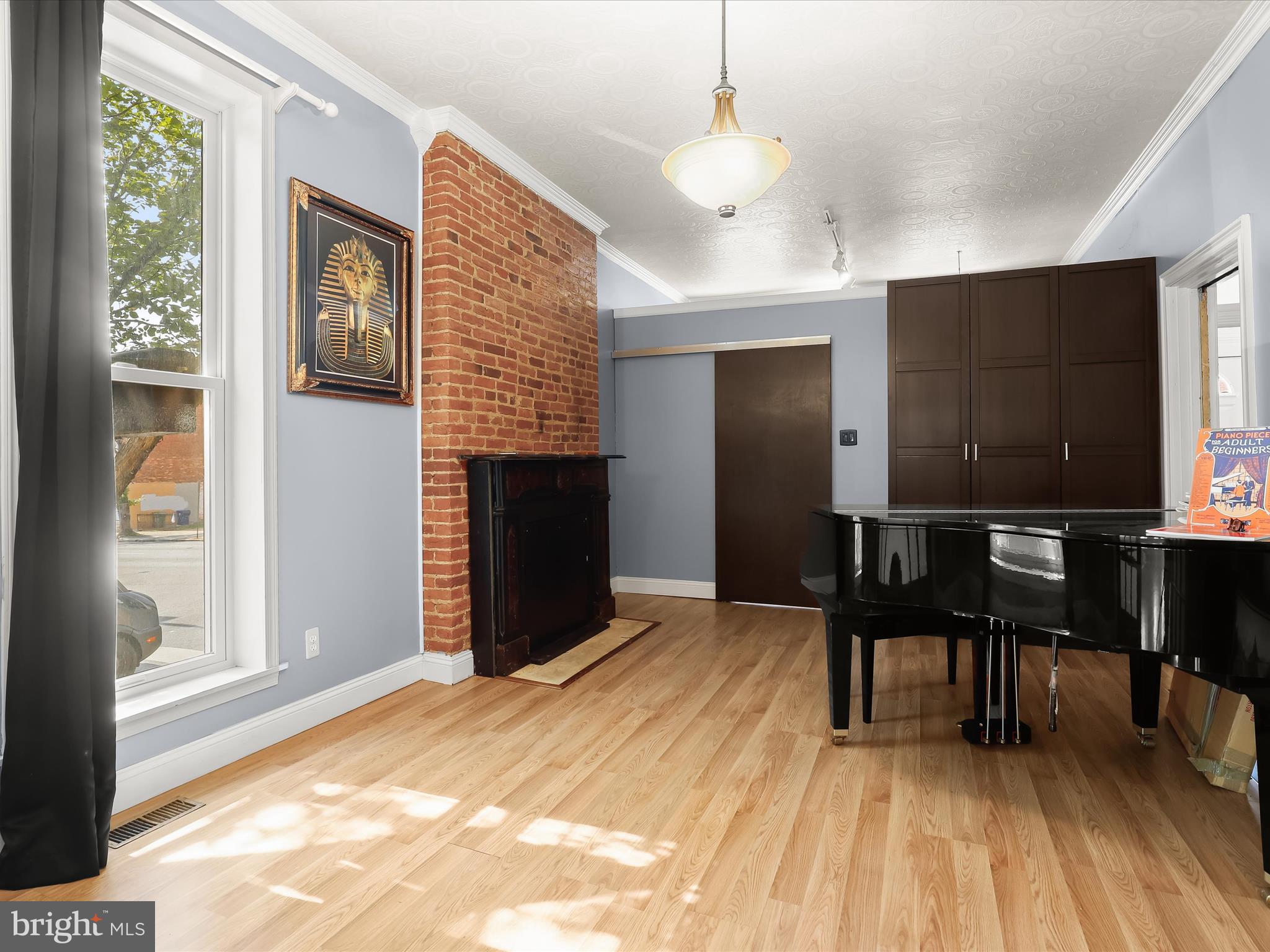 55 South Fulton Avenue Baltimore, MD 21223 - Photo 16 of 55 a view of a livingroom with furniture window and wooden floor