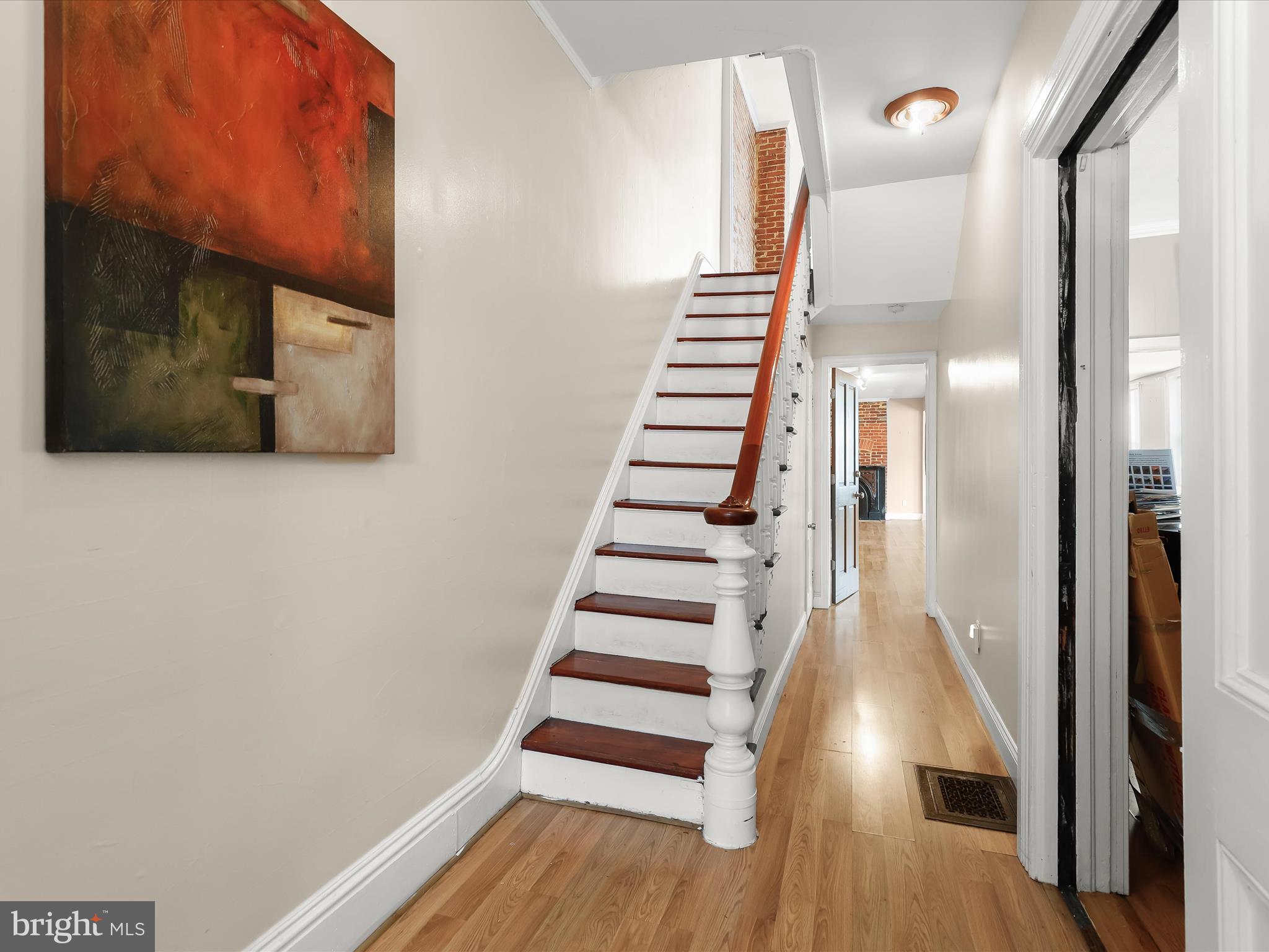 55 South Fulton Avenue Baltimore, MD 21223 - Photo 3 of 55 a view of a hallway with wooden floor and entryway