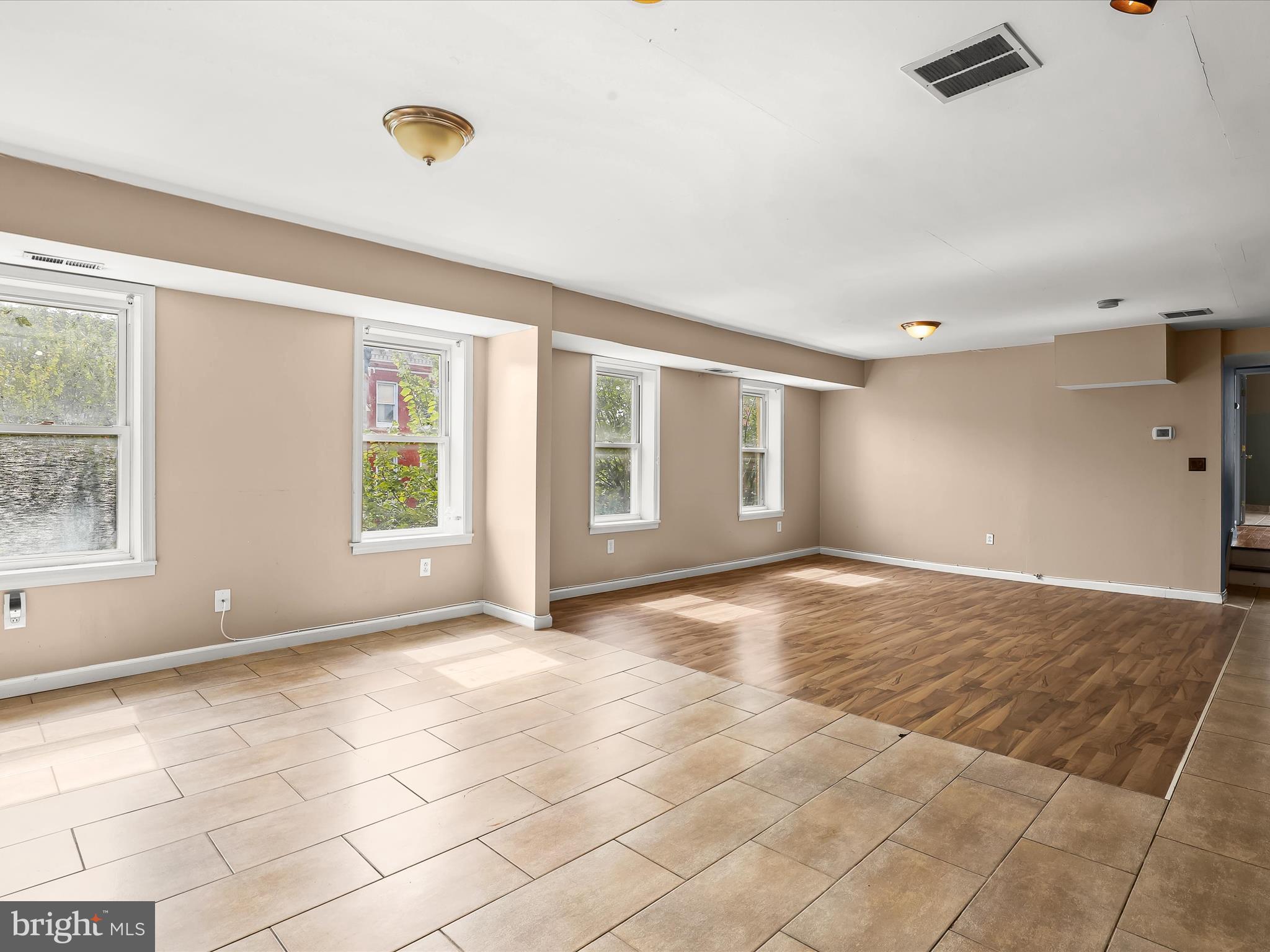 55 South Fulton Avenue Baltimore, MD 21223 - Photo 25 of 55 a view of an empty room with window and chandelier fan