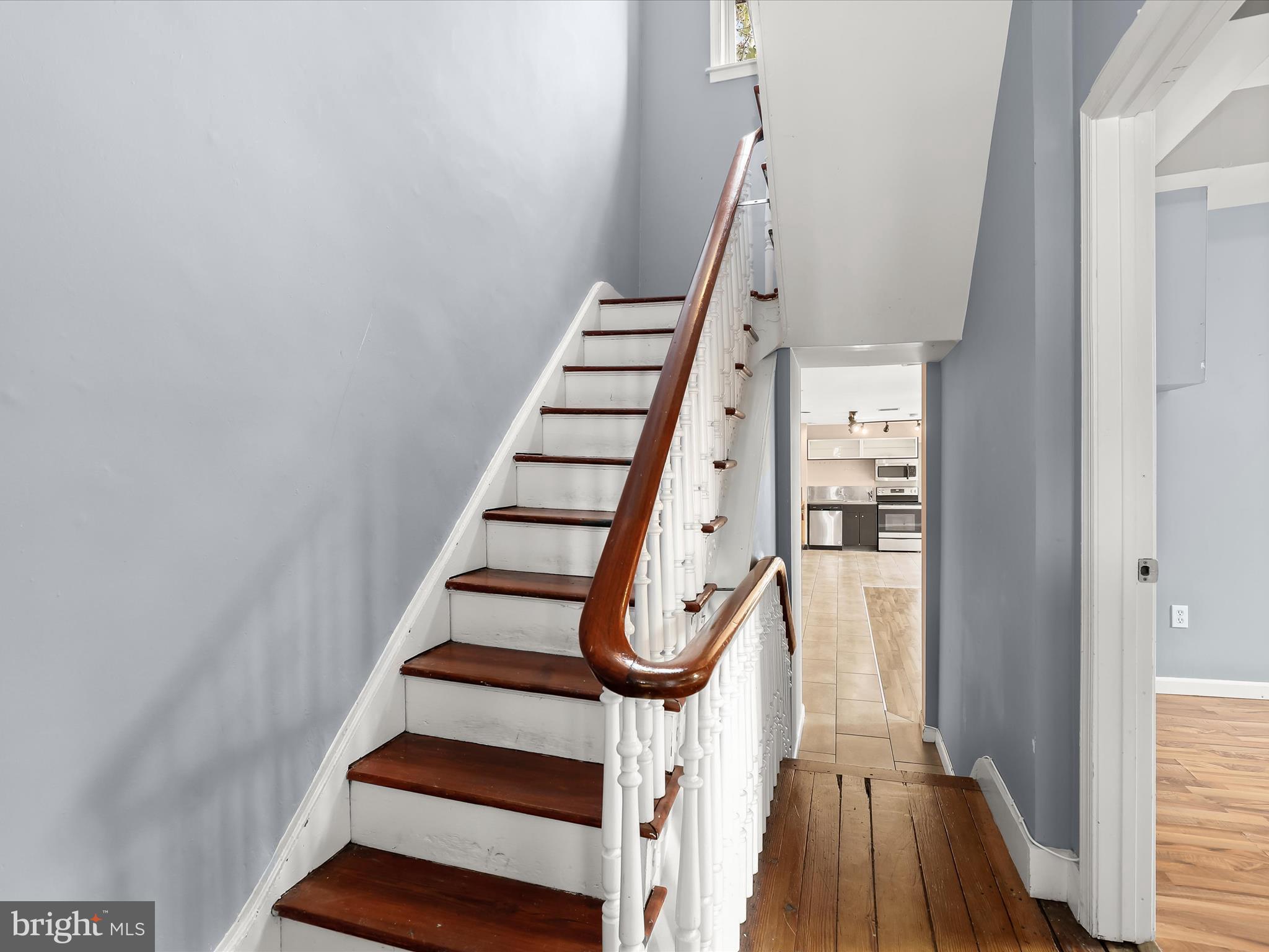 55 South Fulton Avenue Baltimore, MD 21223 - Photo 33 of 55 a view of entryway with wooden floor and stairs