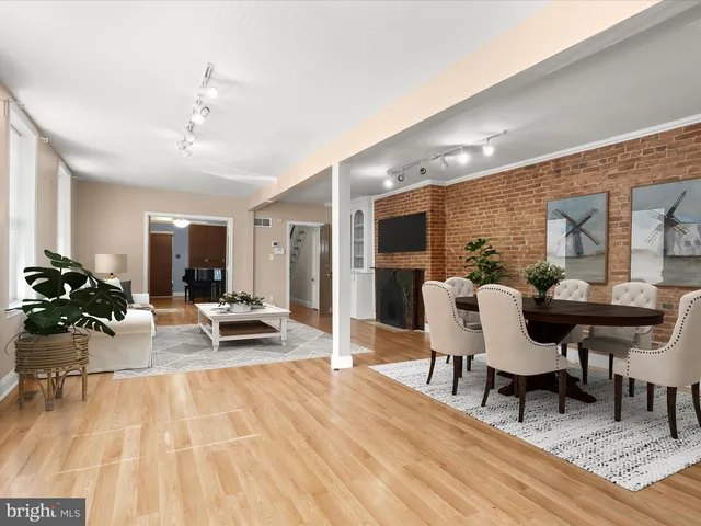a view of a room with wooden floors