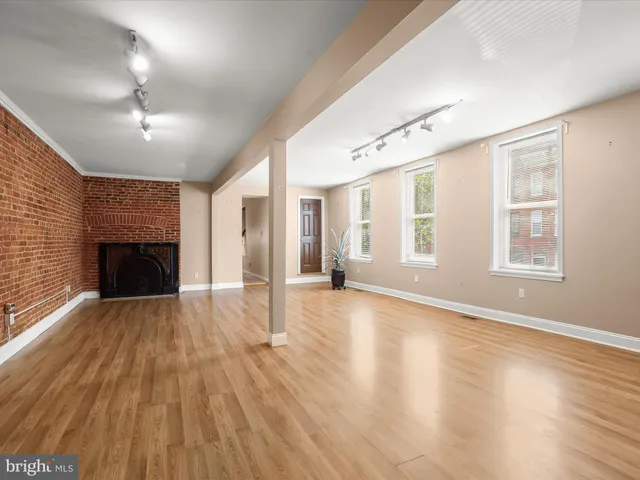 a view of a room with wooden cabinets