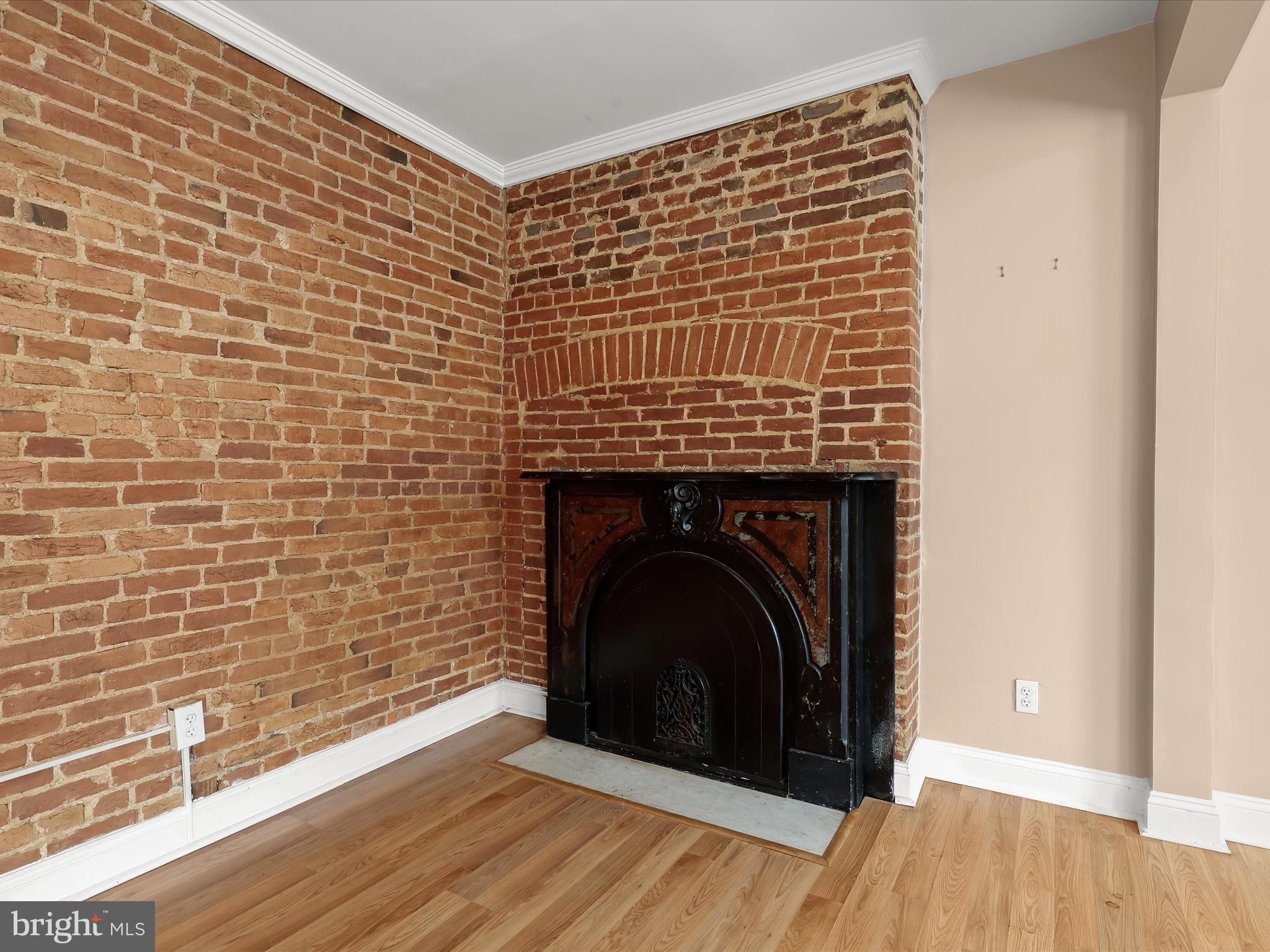 55 South Fulton Avenue Baltimore, MD 21223 - Photo 4 of 55 a close view of a fireplace in wooden floor